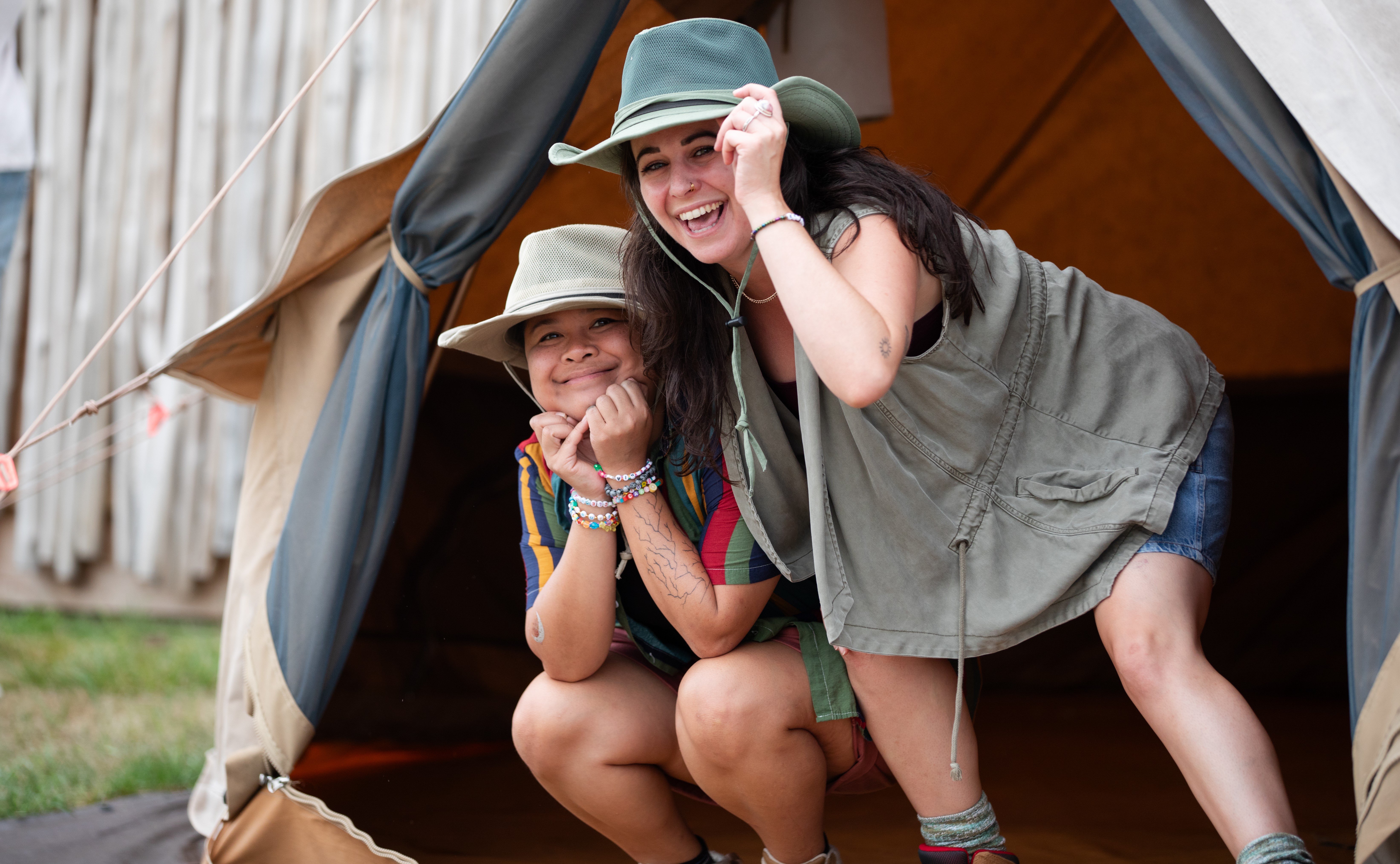 smiling guests in tent