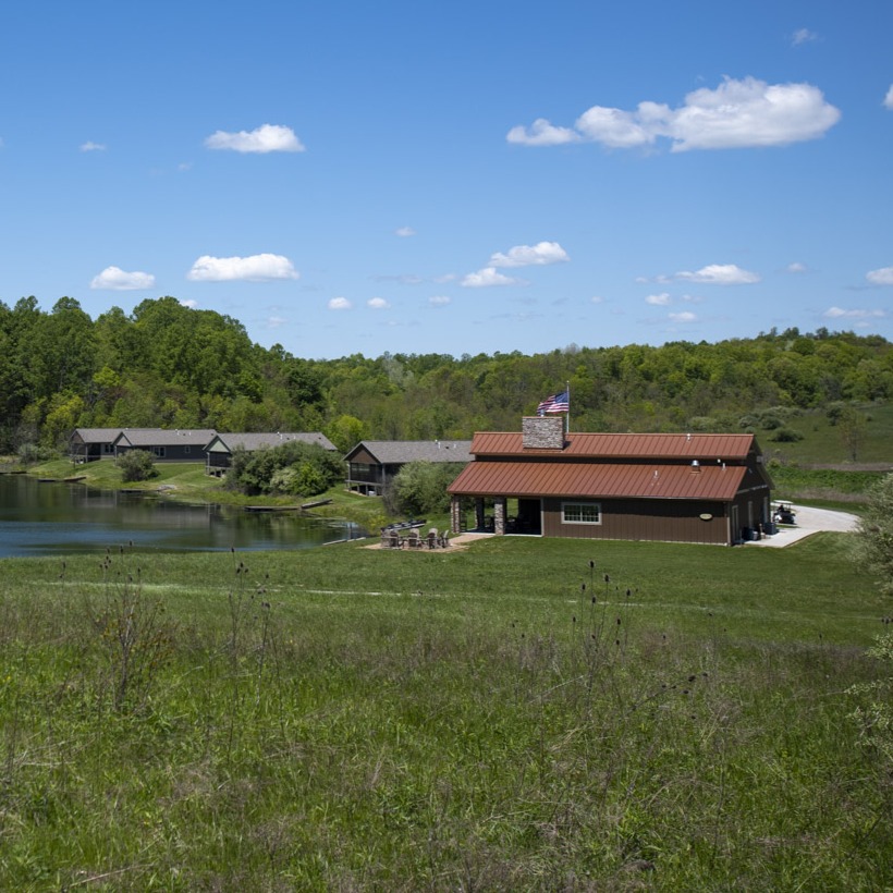 lodge and cabins in pasture