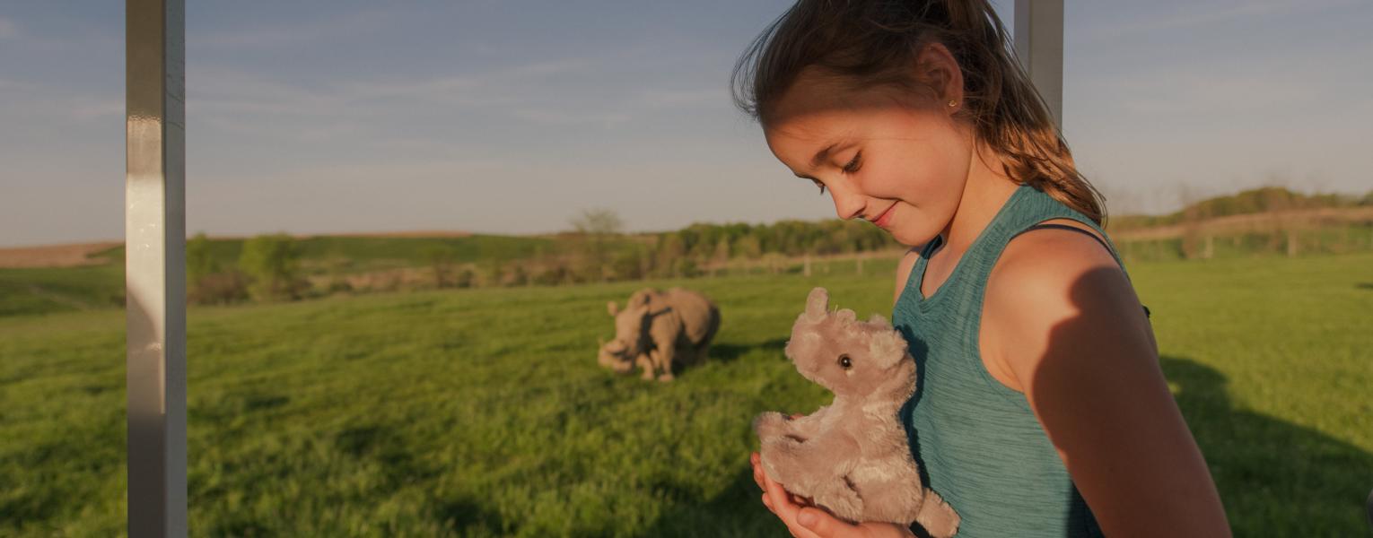 girl holding toy